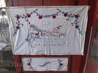 Hand embroidered carpet and tablecloth. Hand stitched