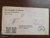 Old envelope with stamps for extra charge