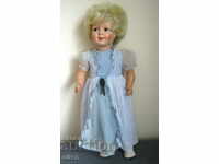 Η πονηρή πορσελάνινη κούκλα Dolly με ρούχα 65 cm