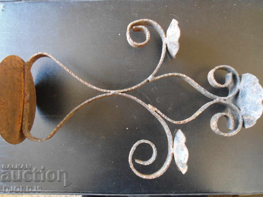 An old forged candlestick with price 7.00 BGN | € 3.58