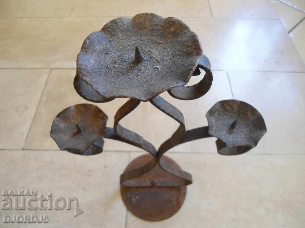 Delivery of An old forged candlestick