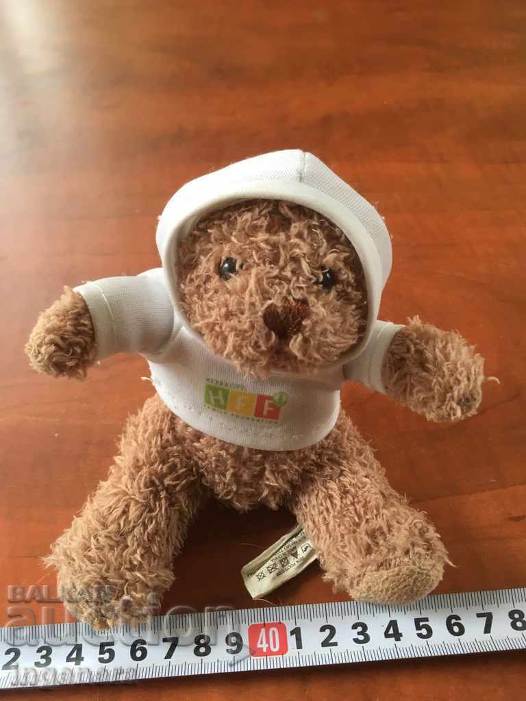 A BEAR DOLL OR ANOTHER TOY FIGURE