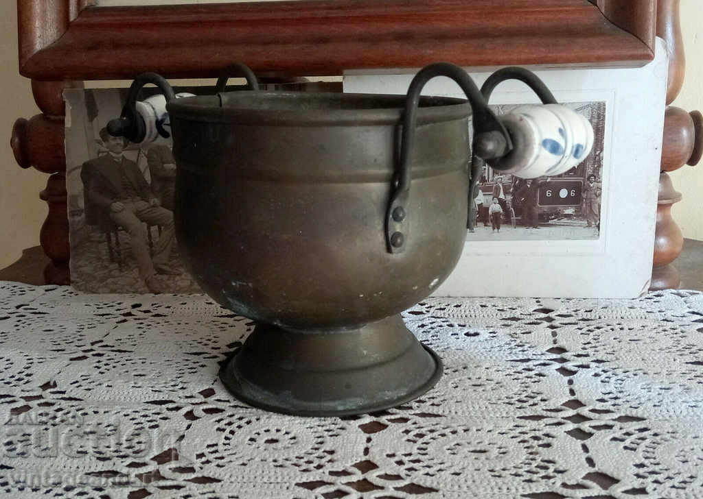 Collectible copper vessel with porcelain handles