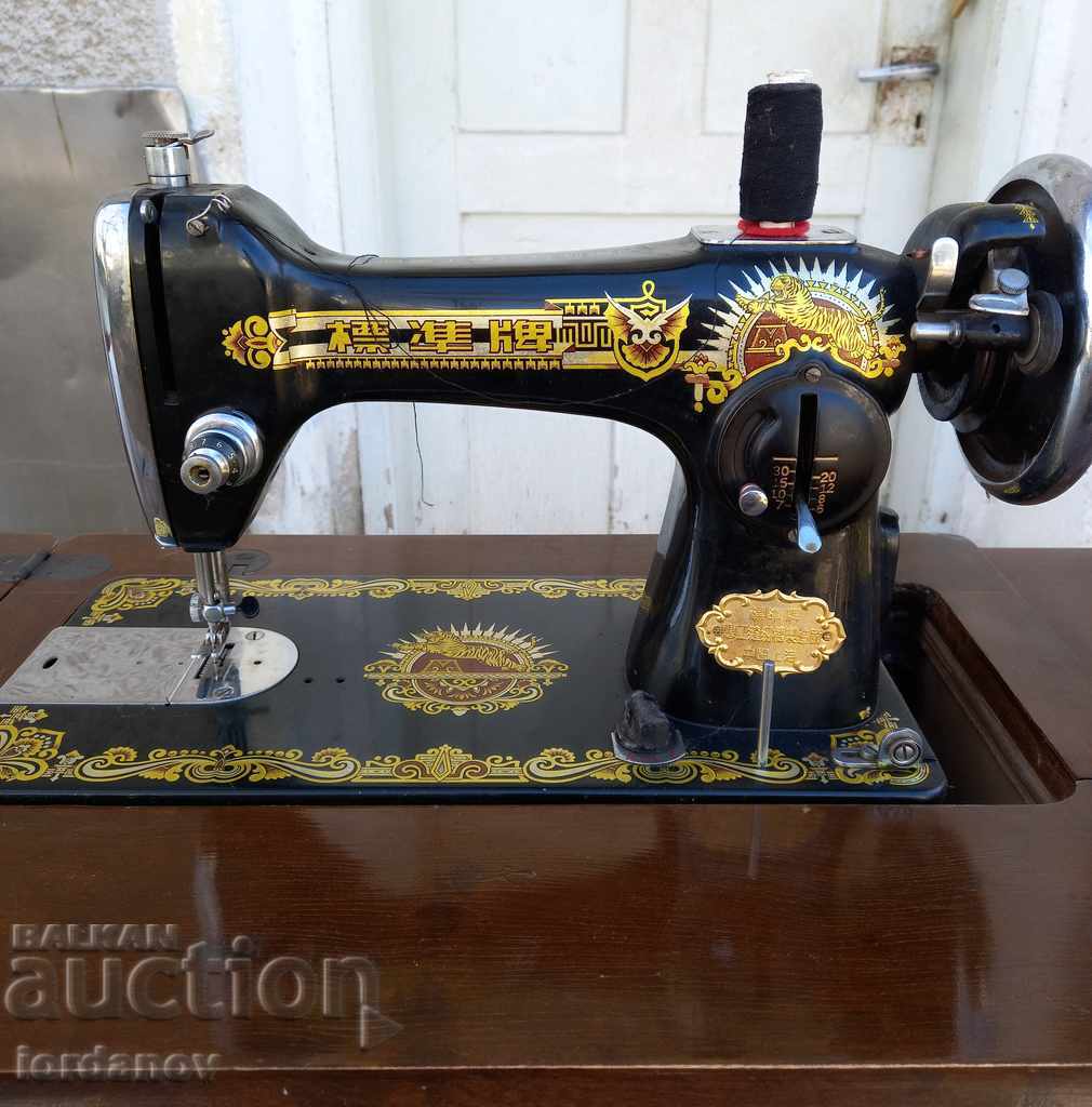 Auction  An old sewing machine.