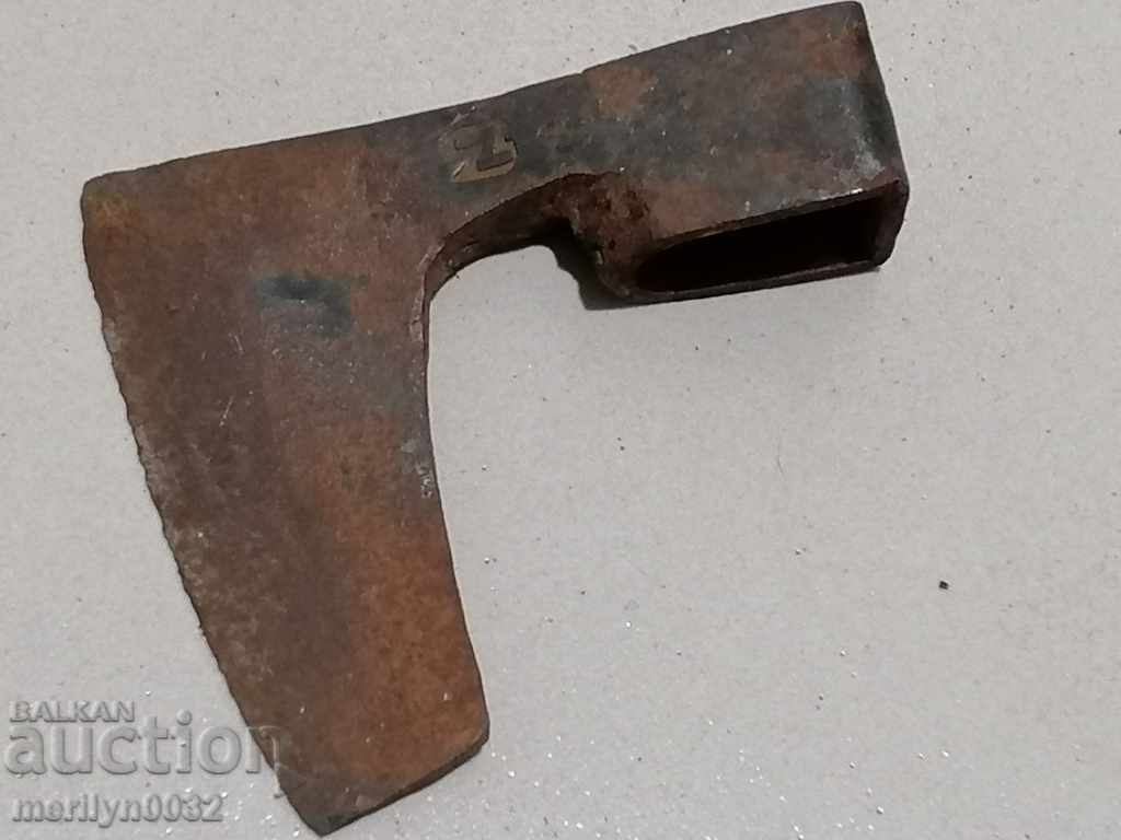 An old ax tool wrought iron