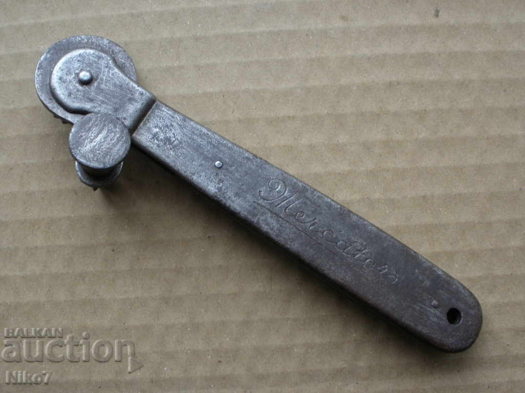 An old, military can opener.