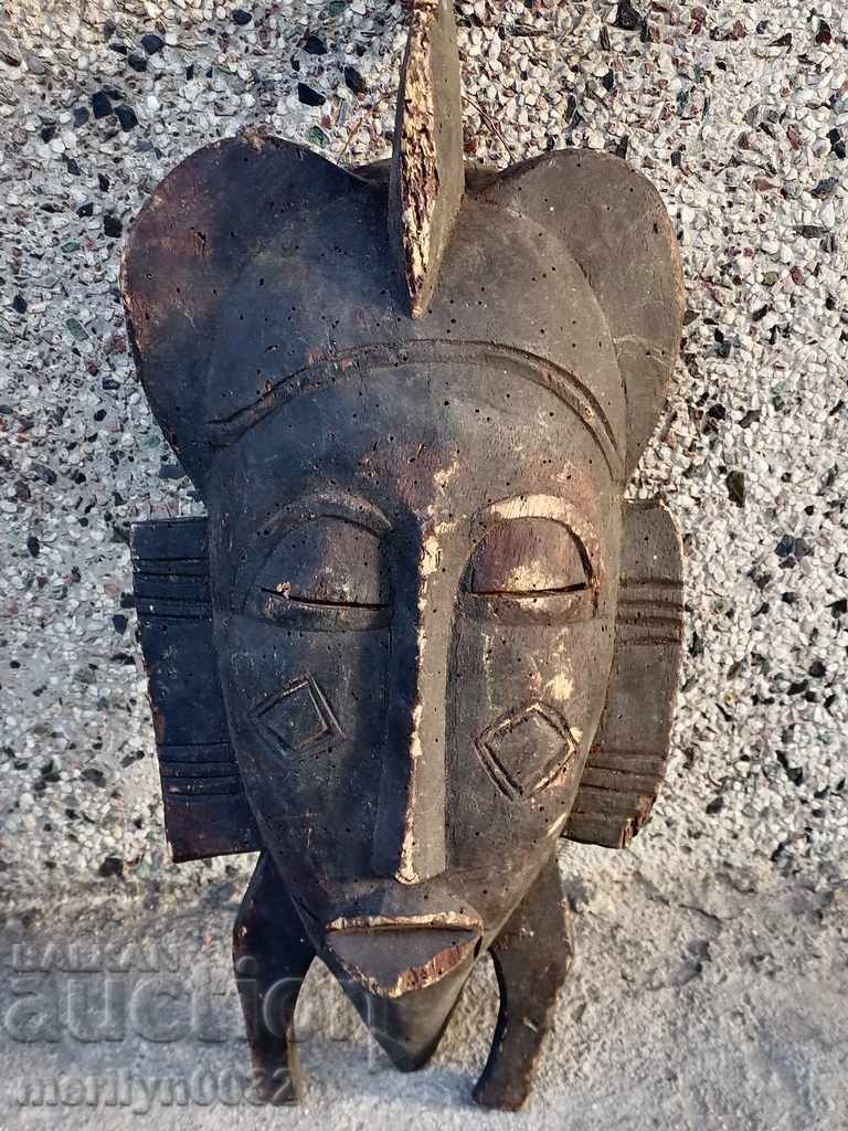 Delivery of Very old African mask carving interior beauty