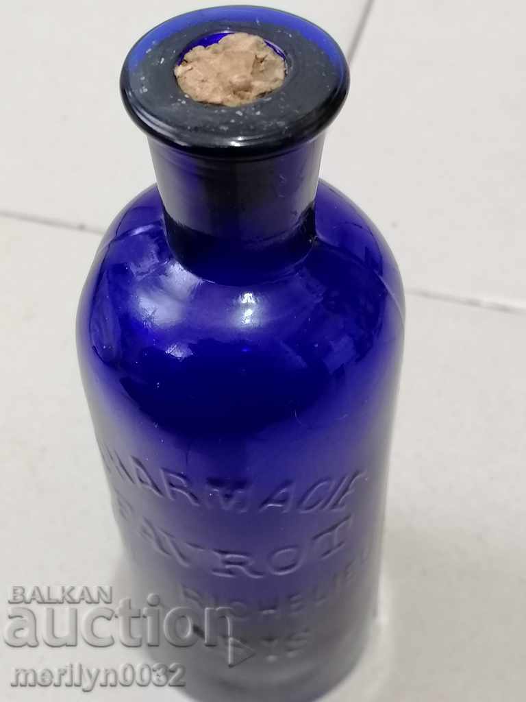 Delivery of Old apothecary's blown bottle of French blue glass Paris Delivery of Old apothecary's blown bottle of French blue glass Paris
