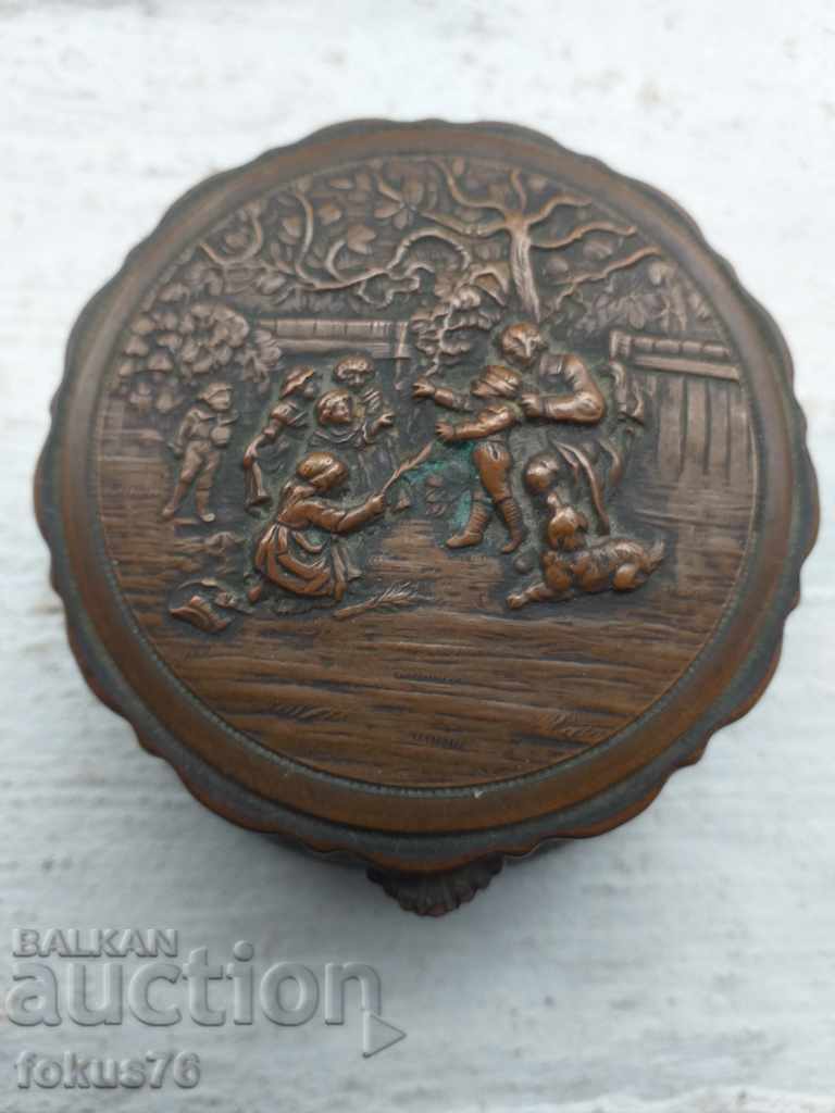 Old wrought bronze box with silk markings