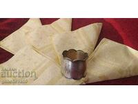 A rare silver napkin holder and 5 silk towels