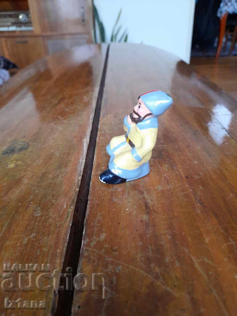 Delivery of Old ceramic figurine, man
