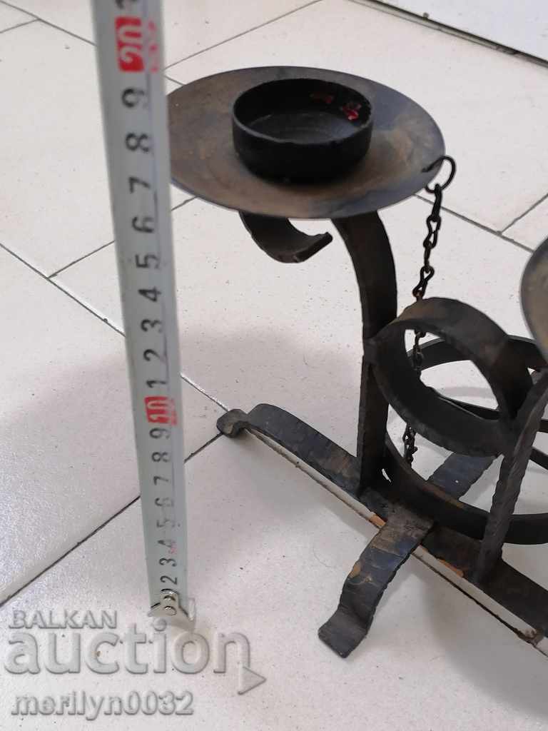 Auction  Socialist wrought iron candlestick with dilaf