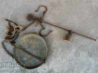 An old scale with a copper bowl, a mace, a wrought-iron scale