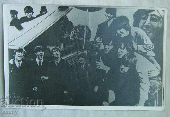 An old big photo of the Beatles pop / rock band