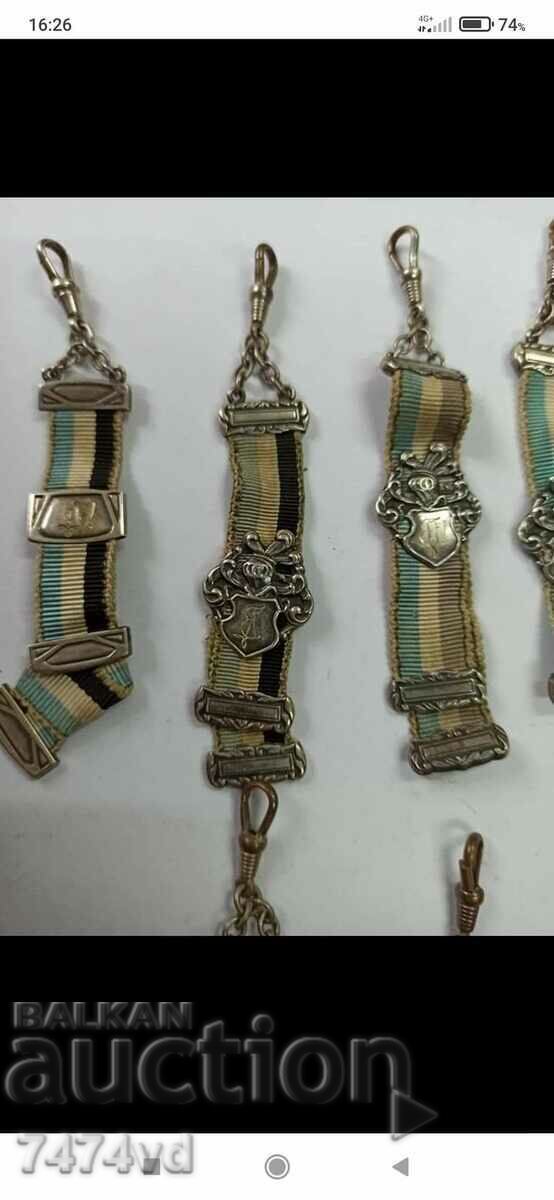 Auction  Ribbons with silver elements of orders or orders