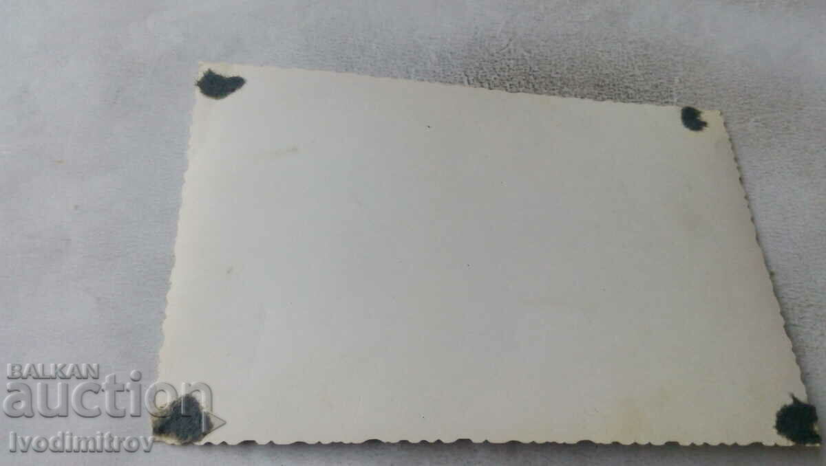 Photo of a man with a damajana and two officers with suitcases with price 1.65 BGN | € 0.84 Photo of a man with a damajana and two officers with suitcases with price 1.65 BGN | € 0.84