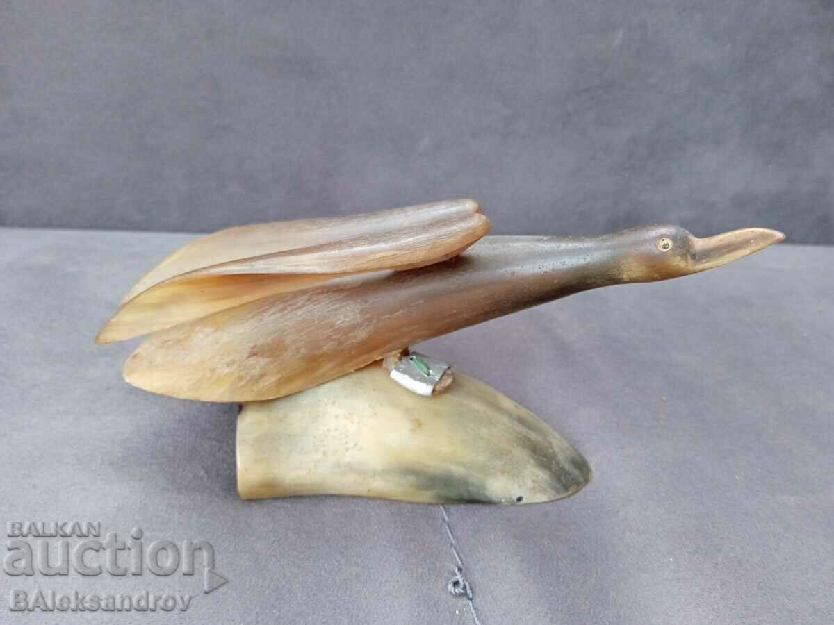 Old horn figurine, bird