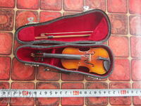 Unique mini violin in a case with a bow