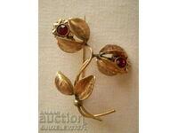 old double brooch flower with red crystal