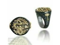 Men's black ring with dragon and topaz
