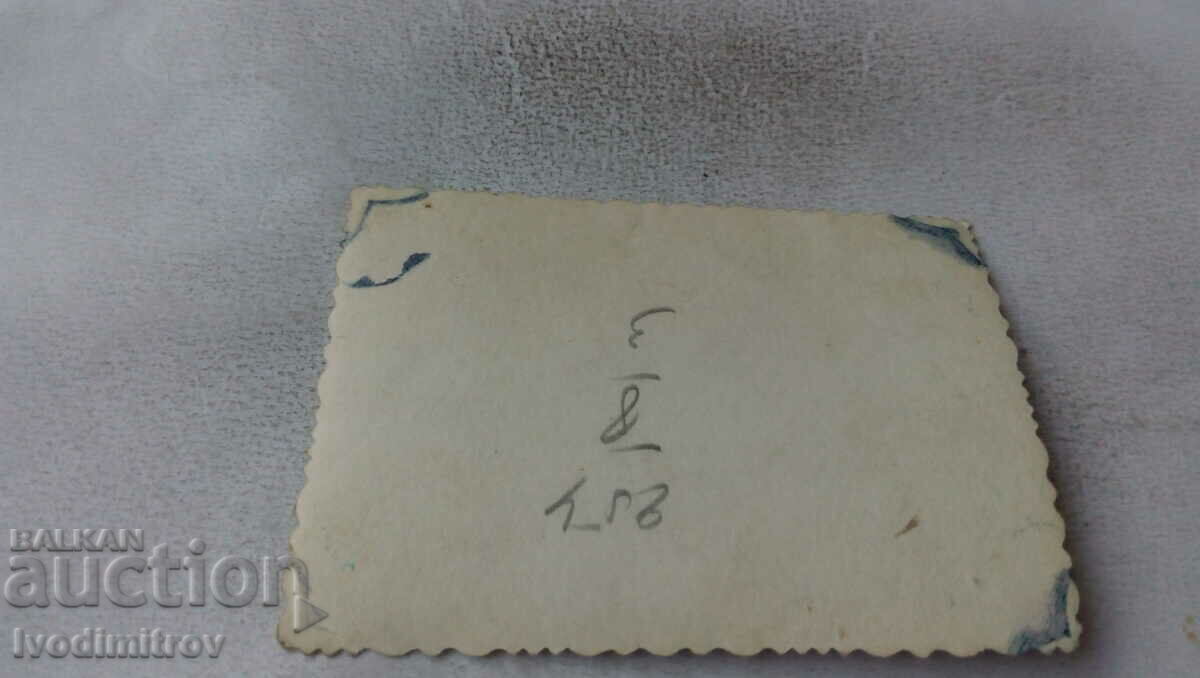 Photo Two girls and two boys in front of TNO factory AD with price 1.85 BGN | € 0.95