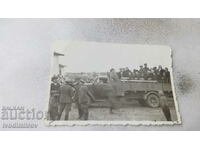 Photo Karnobat Officers and civilians in front of a retro truck