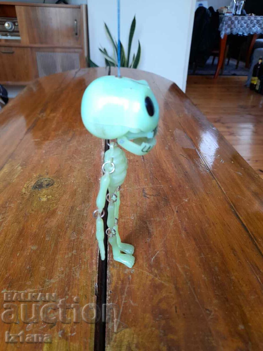 Auction  Old toy, souvenir skeleton