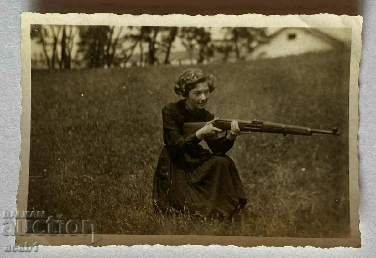 A woman with a rifle