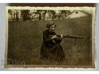 A woman with a rifle