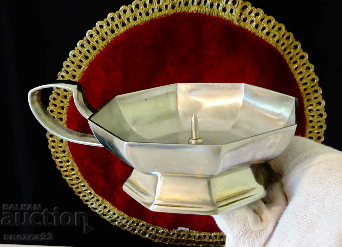 Auction An octagonal tin candlestick. Auction An octagonal tin candlestick.