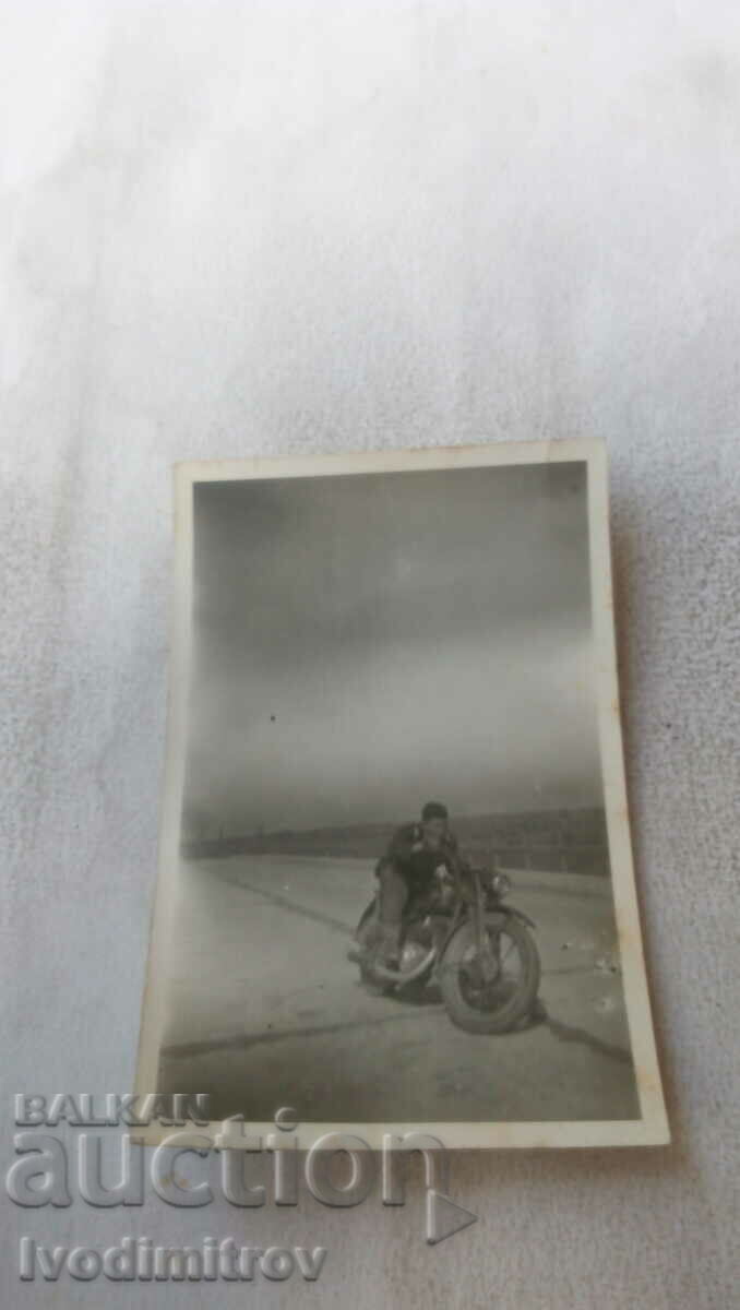 Photo Soldier on a retro motorcycle
