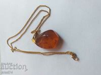 Gold-plated chain with amber pendant