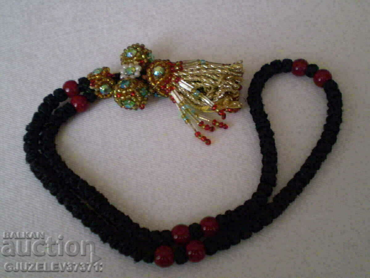 Delivery of Christian ammolet with beads
