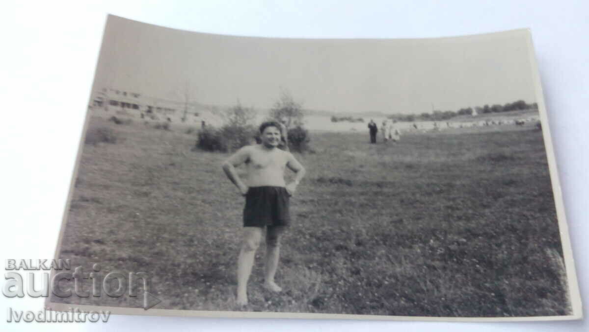 Photo Man with shorts on the lawn 1954