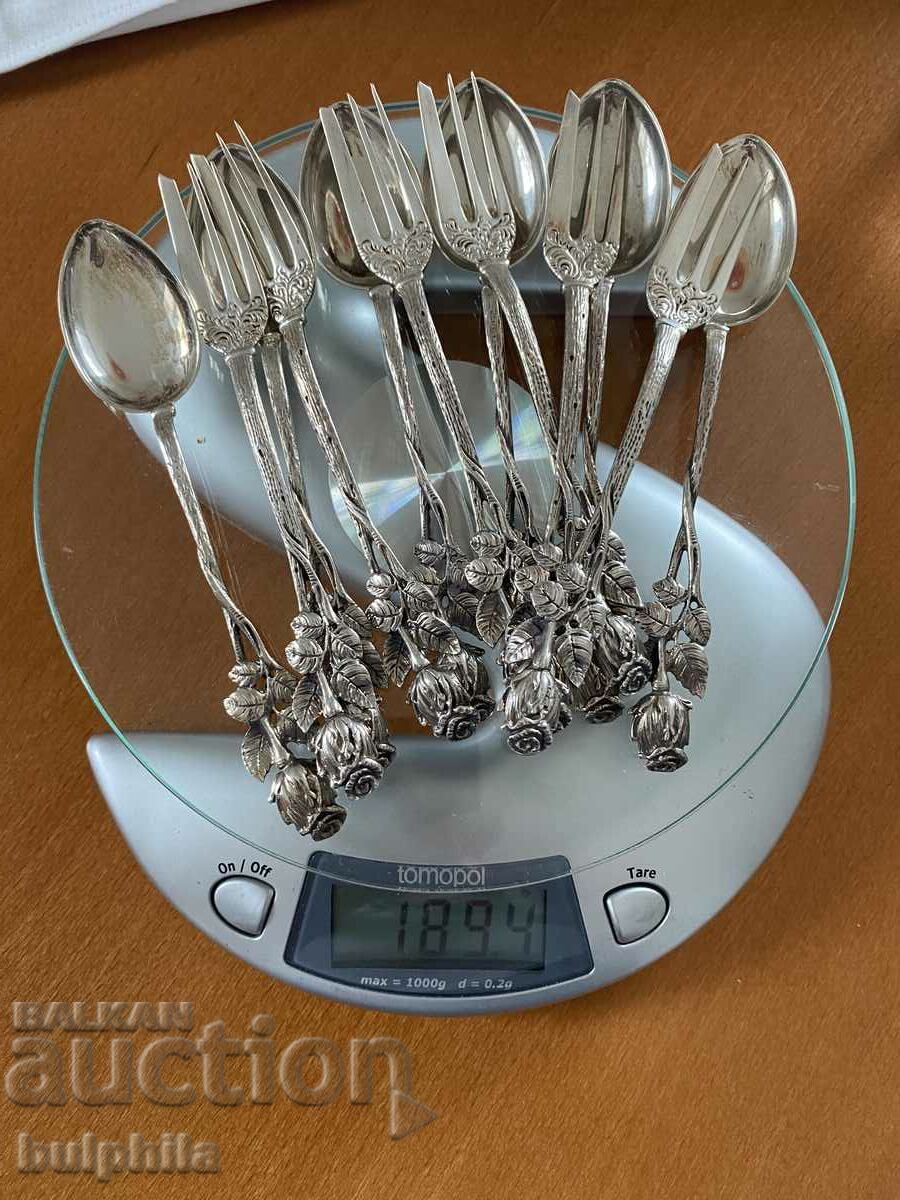 Auction Set of 6 silver dessert forks and 6 spoons. Auction Set of 6 silver dessert forks and 6 spoons.