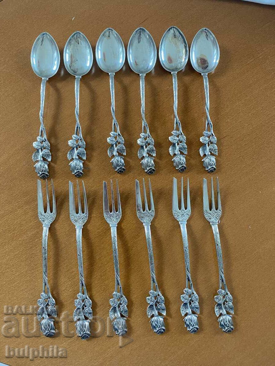Set of 6 silver dessert forks and 6 spoons. Set of 6 silver dessert forks and 6 spoons.