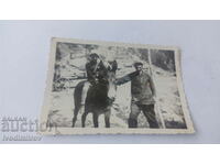 Fotografie Bărbat și băiețel călare pe un măgar 1938