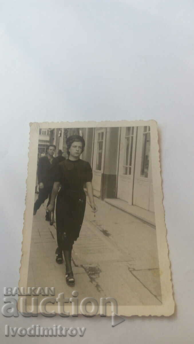 Photo Sofia Young woman in a black dress on a walk