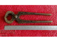Old forged metal pliers cherped master
