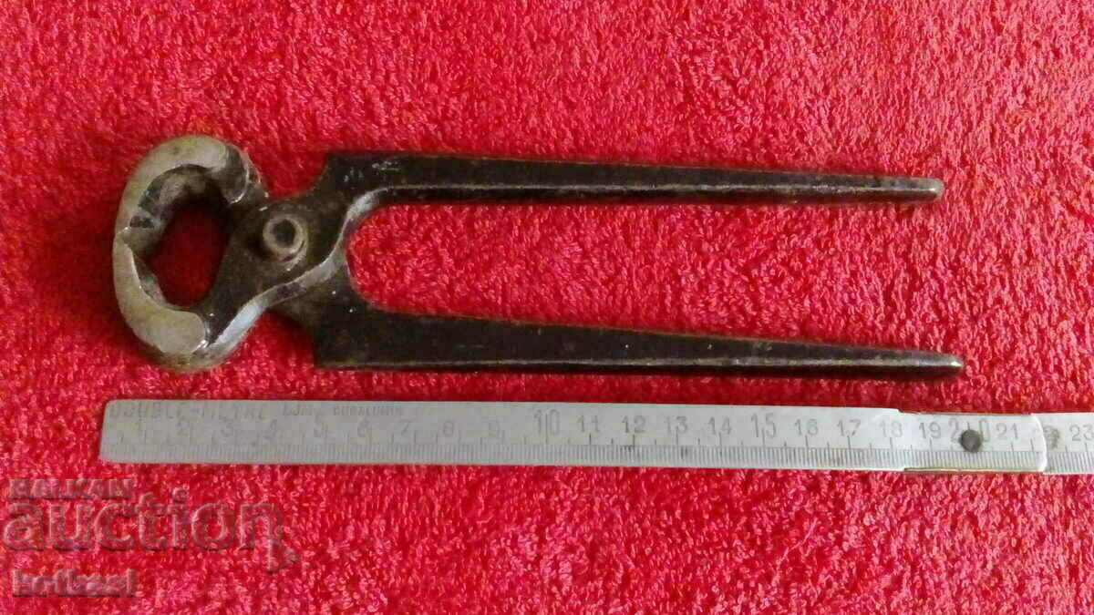 Old forged metal pliers cherped master