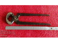 Old forged metal pliers cherped master