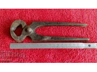 Old forged metal pliers cherped master