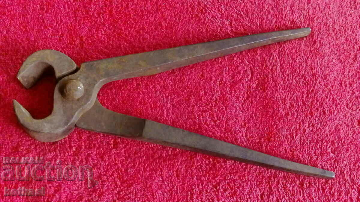Delivery of Old forged massive metal pliers serpentine master Delivery of Old forged massive metal pliers serpentine master