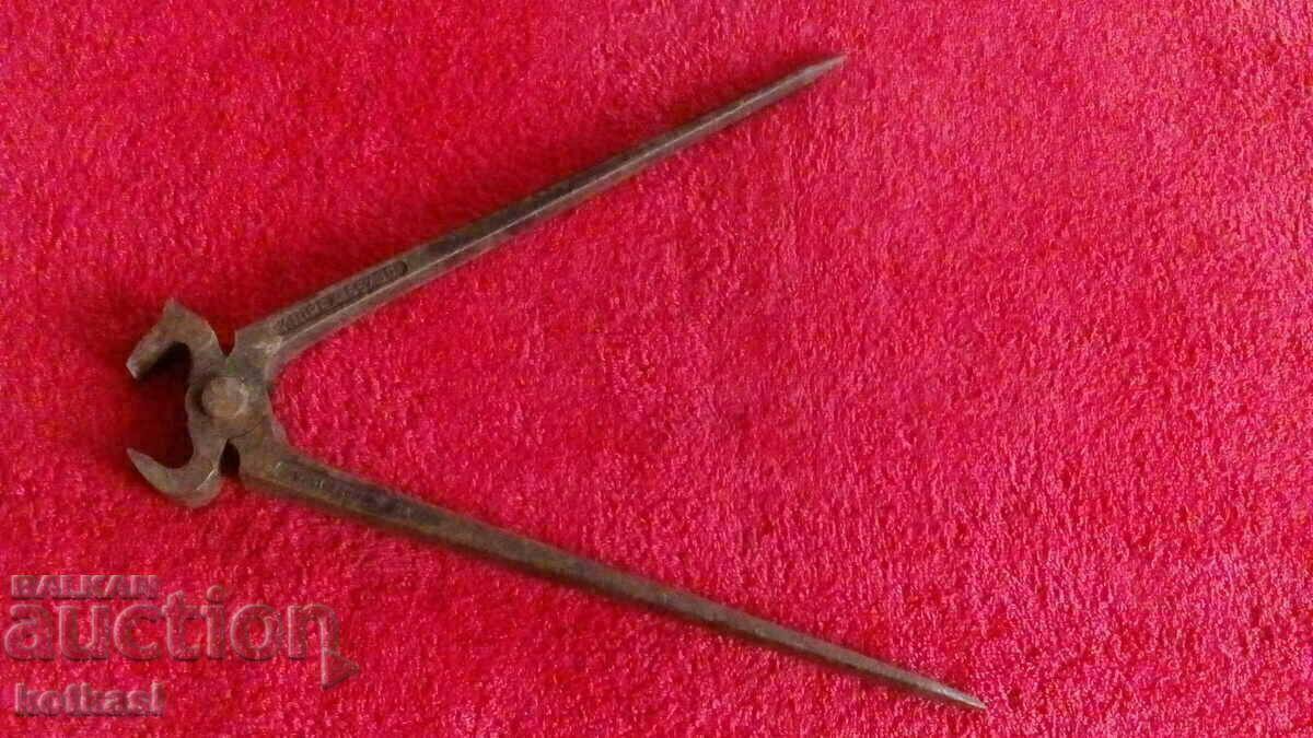 Delivery of Old forged metal marked large pliers plywood German Delivery of Old forged metal marked large pliers plywood German