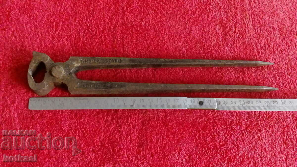 Old forged metal marked large pliers plywood German