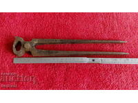 Old forged metal marked large pliers plywood German