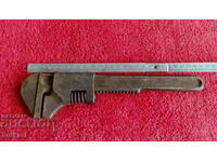 Old metal movable wrench master