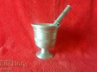 Old mortar made of white metal bronze aluminum mortar