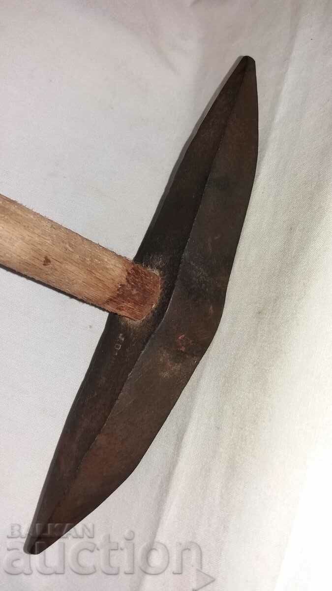 Old heavy branded pickaxe tool
