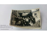 Photo Young men and women in front of the heating plant